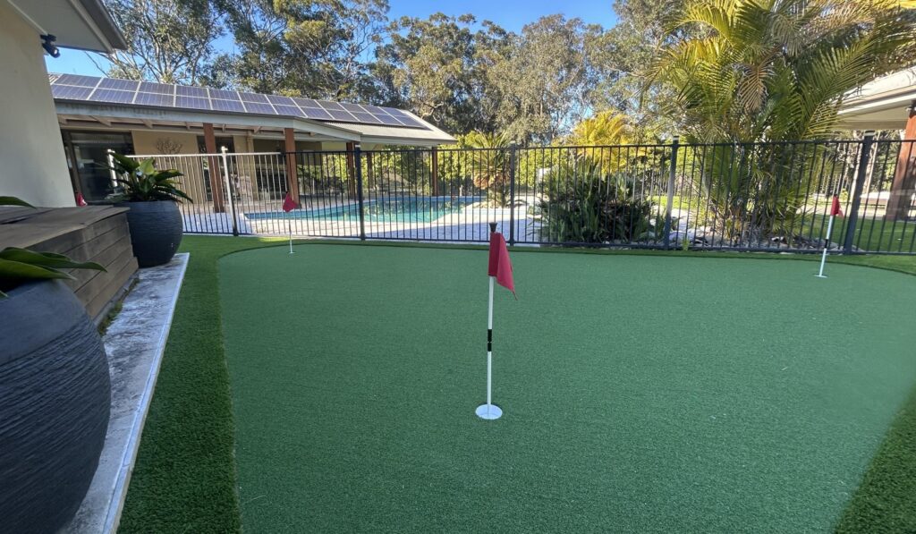 Backyard putting green in modern home